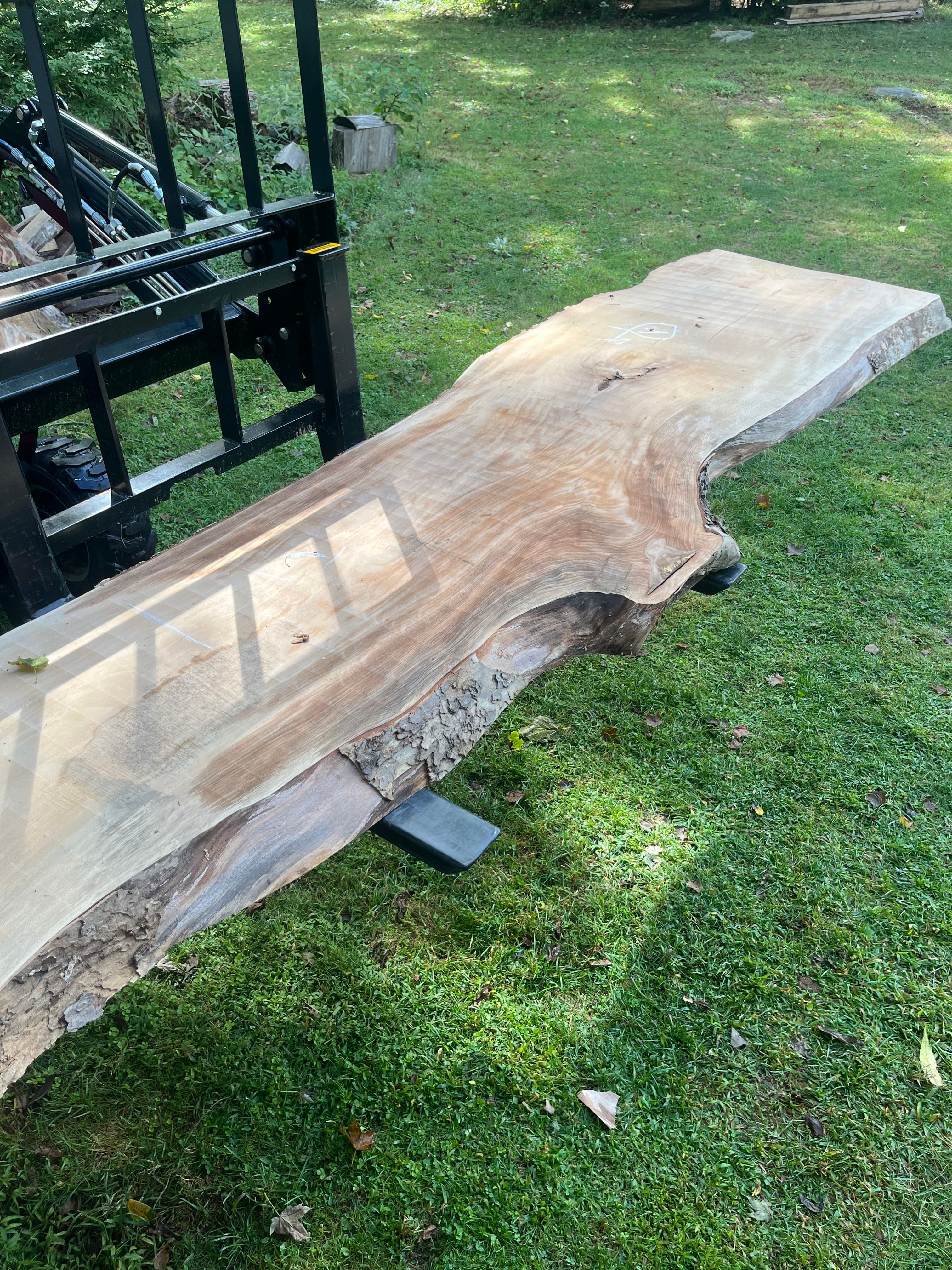 Large Live Edge Slab Propped Outdoors With Tractor | Tougas Timberworks Monroe CT