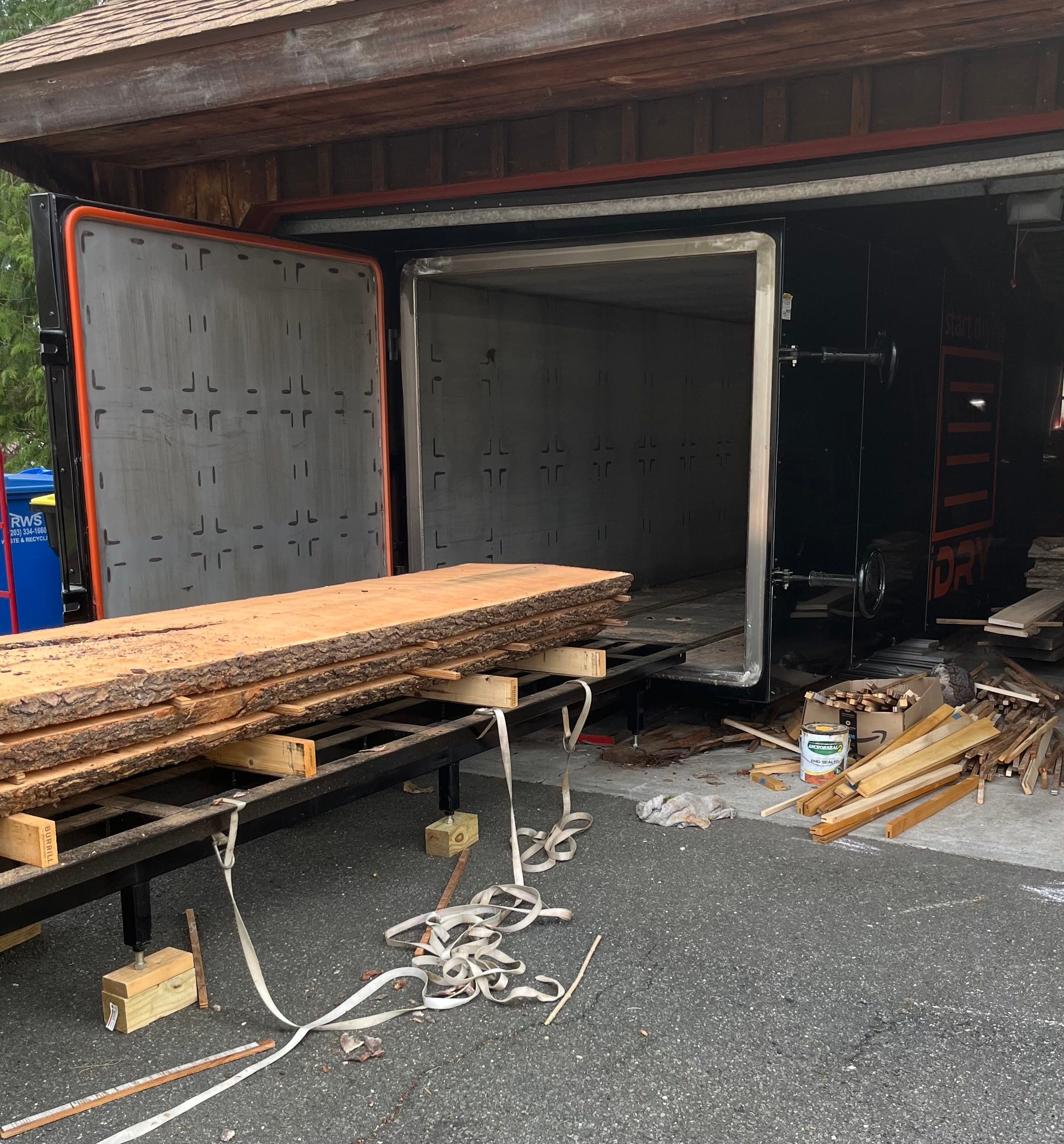 Slabs Being Unloaded From Kiln Cart | Tougas Timberworks Monroe CT