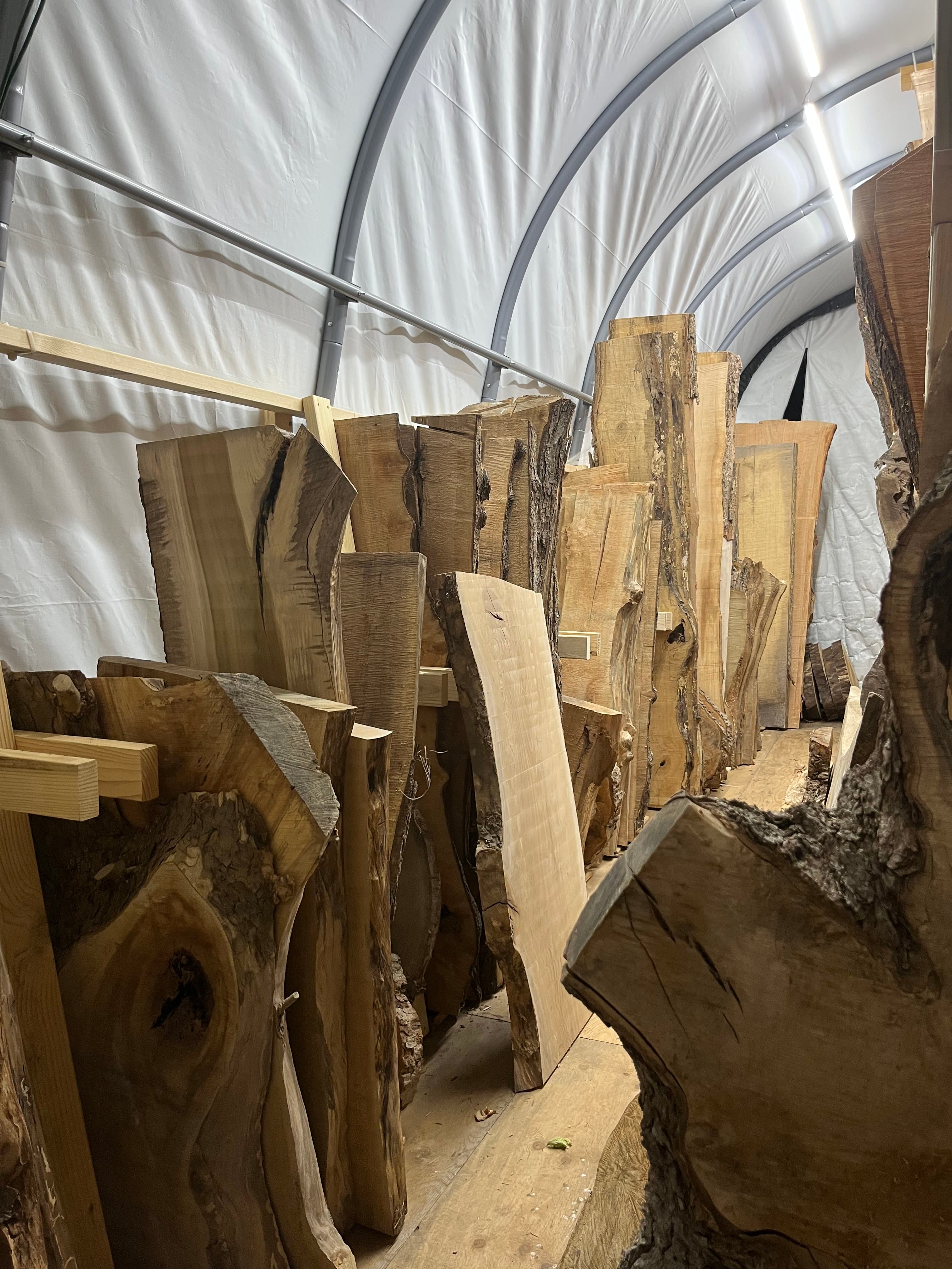Slabs In Tent Storage End View | Tougas Timberworks Monroe CT