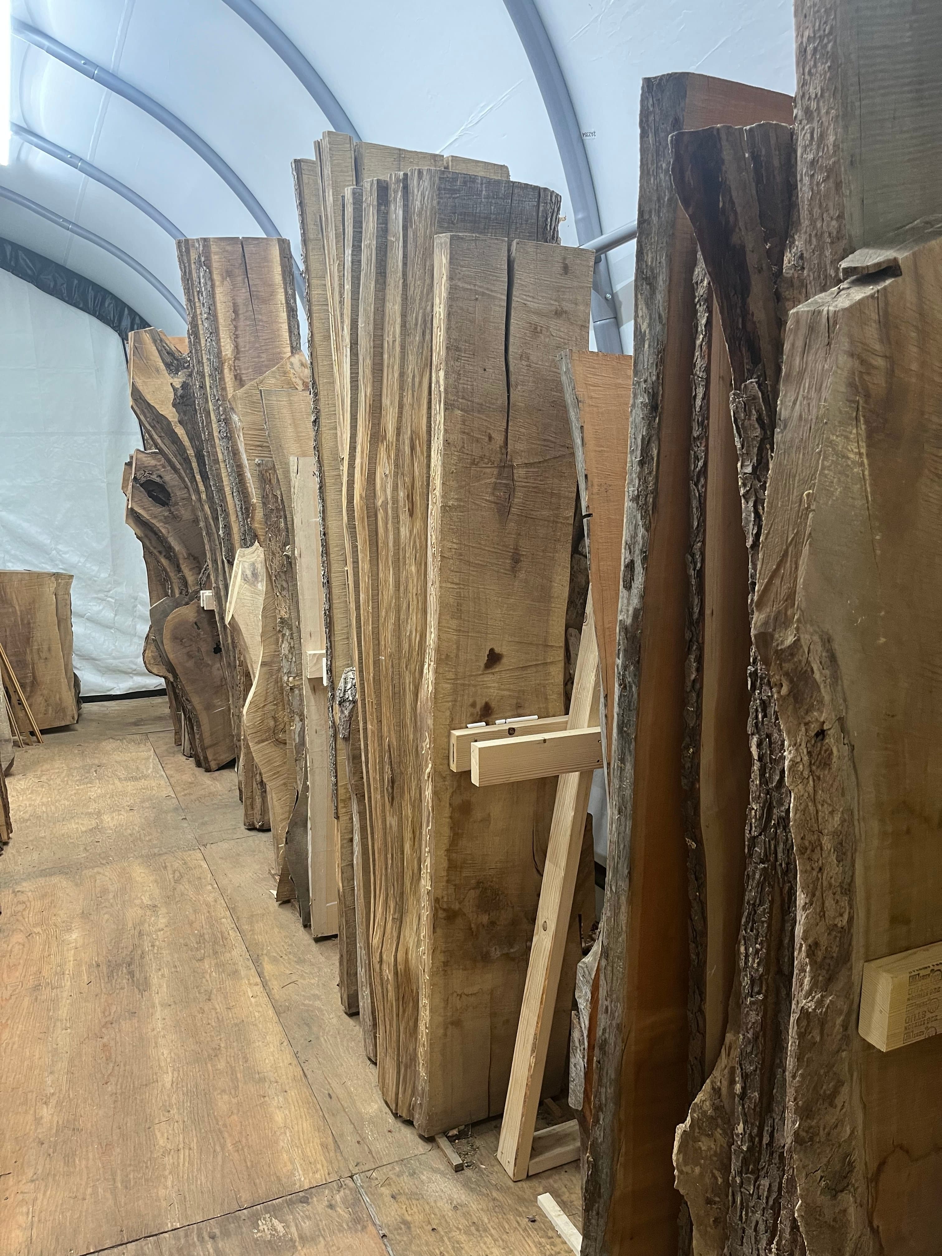 Slabs Stacked In Tent Mixed Species | Tougas Timberworks Monroe CT