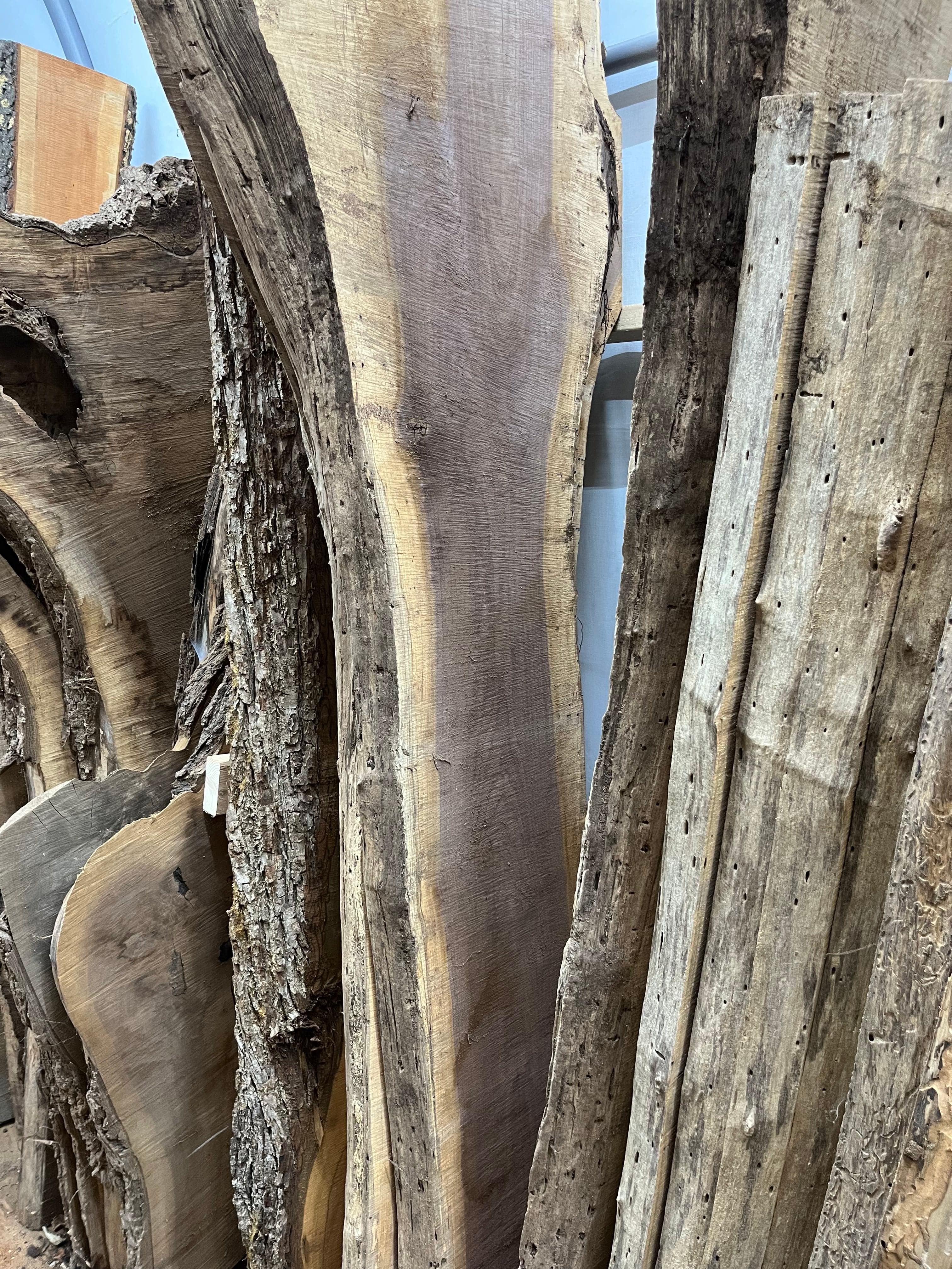 Slabs Stacked Overhead In Shop | Tougas Timberworks Monroe CT