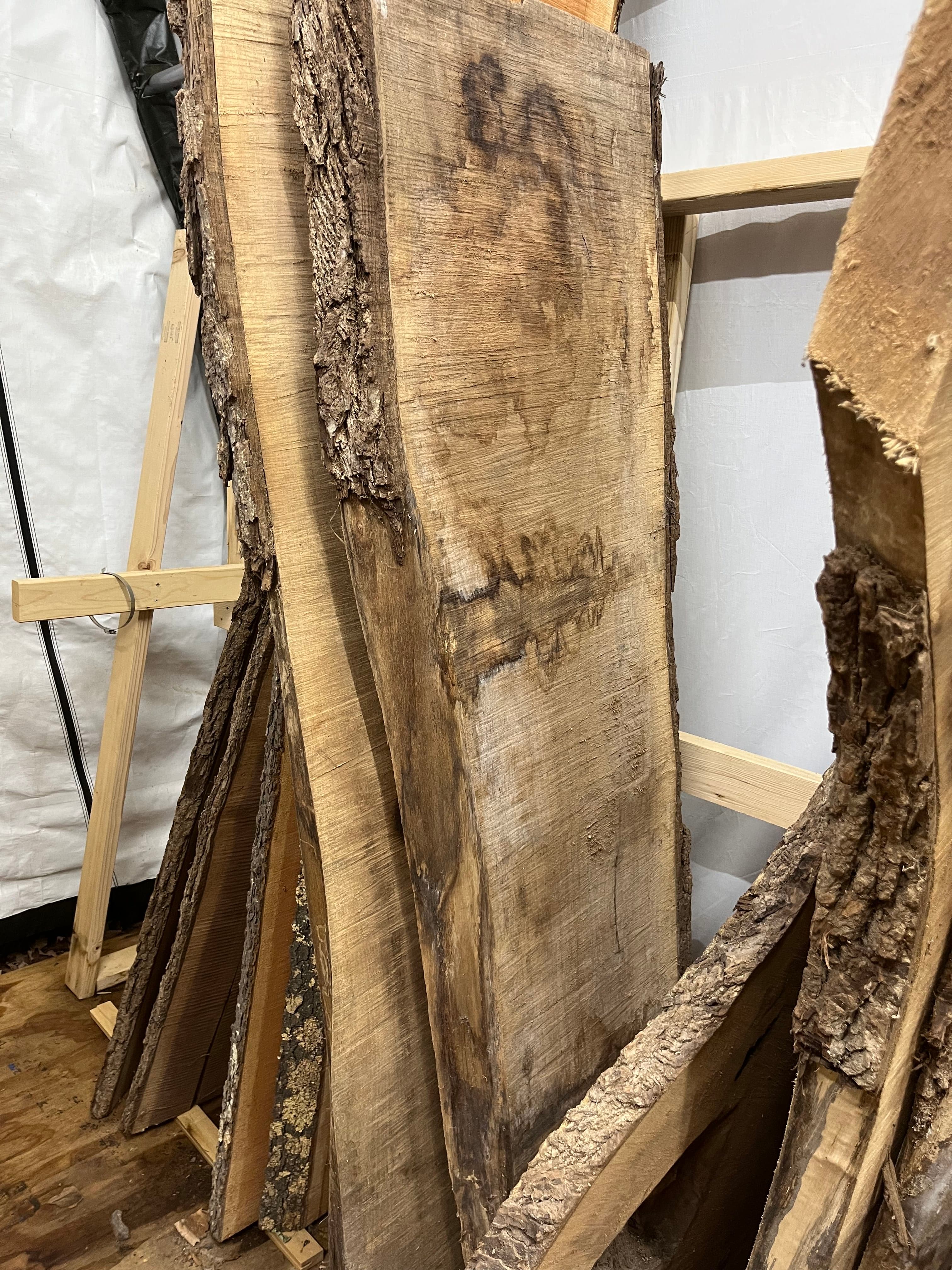 Slabs Stacked Overhead In Shop | Tougas Timberworks Monroe CT