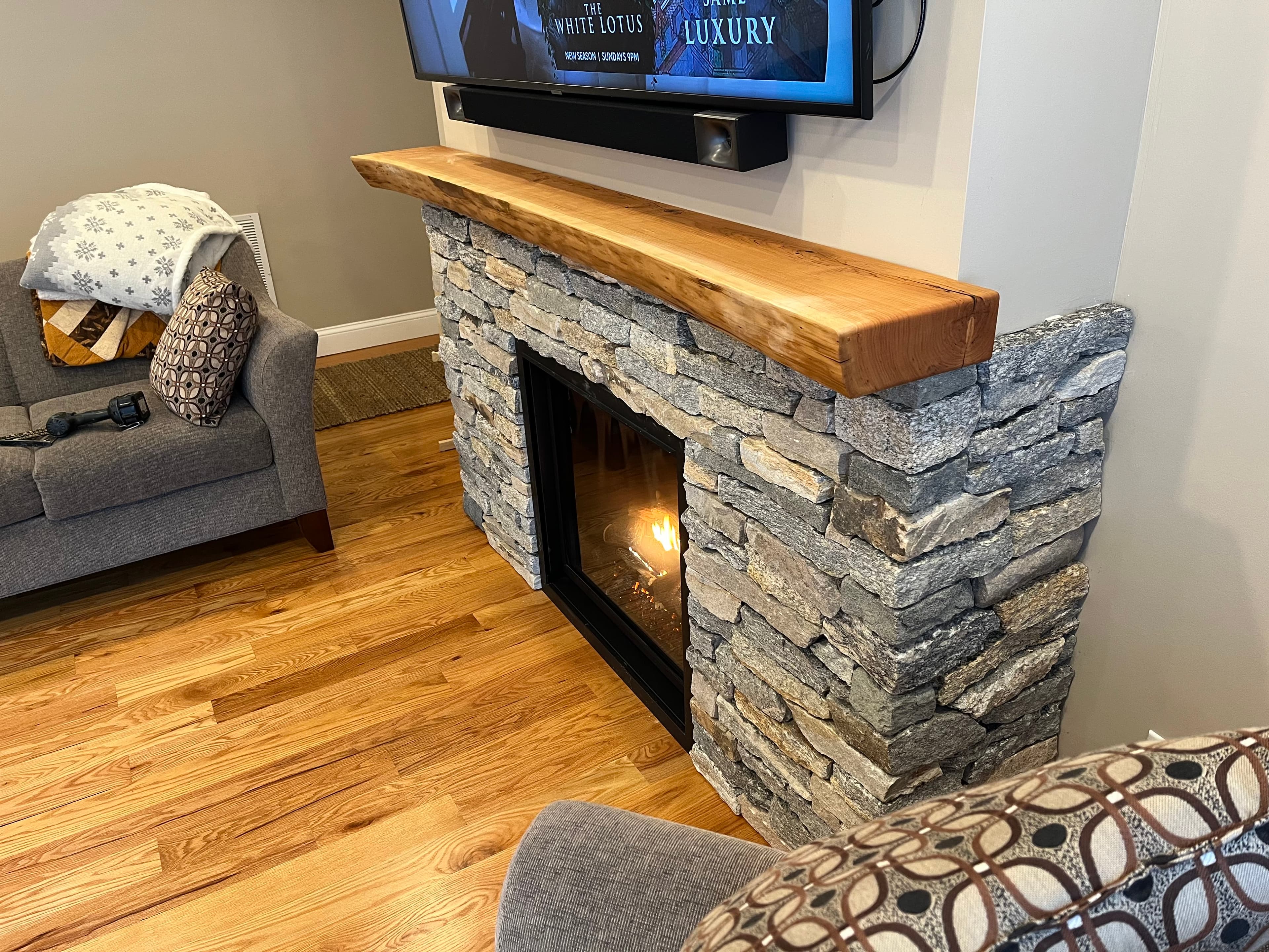 Stone Fireplace Live Edge Mantel Lit | Tougas Timberworks Monroe CT