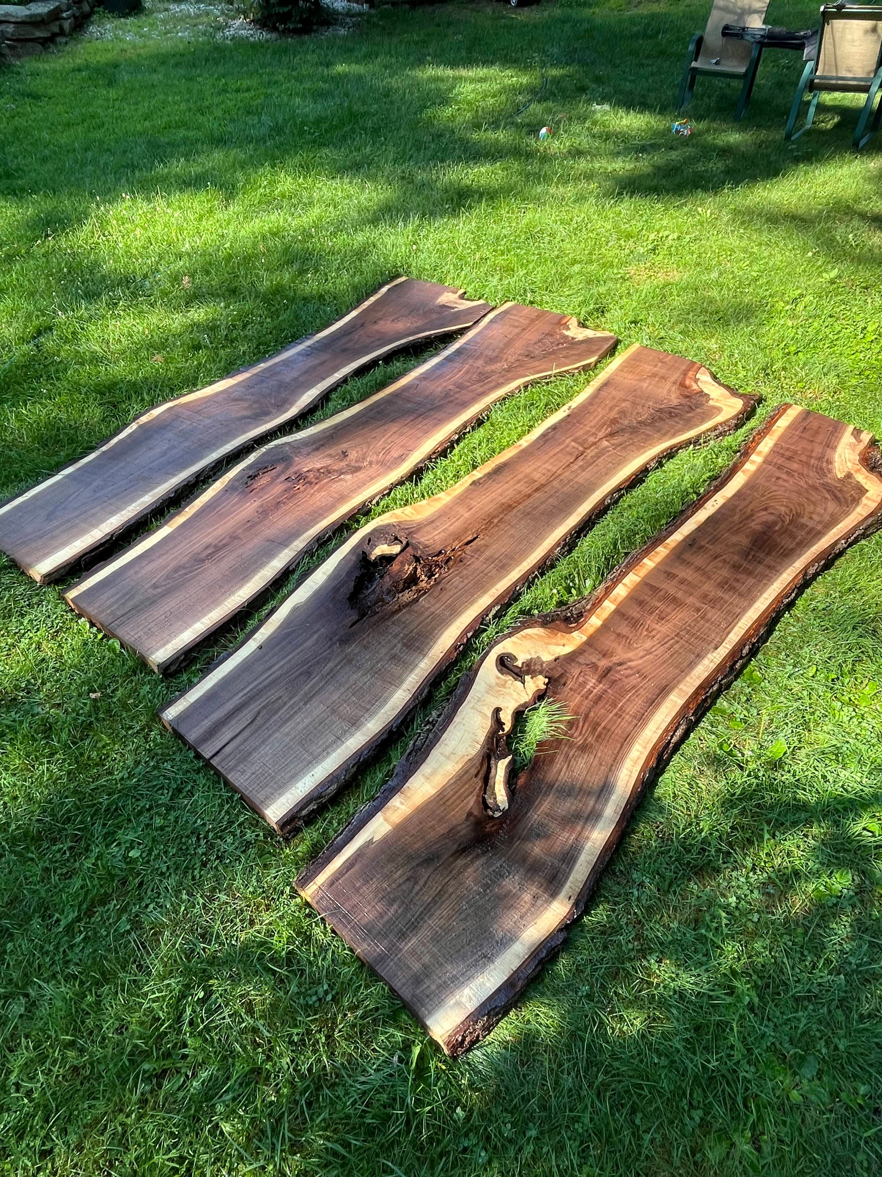 Walnut Slabs Displayed On Grass Aerial | Tougas Timberworks Monroe CT