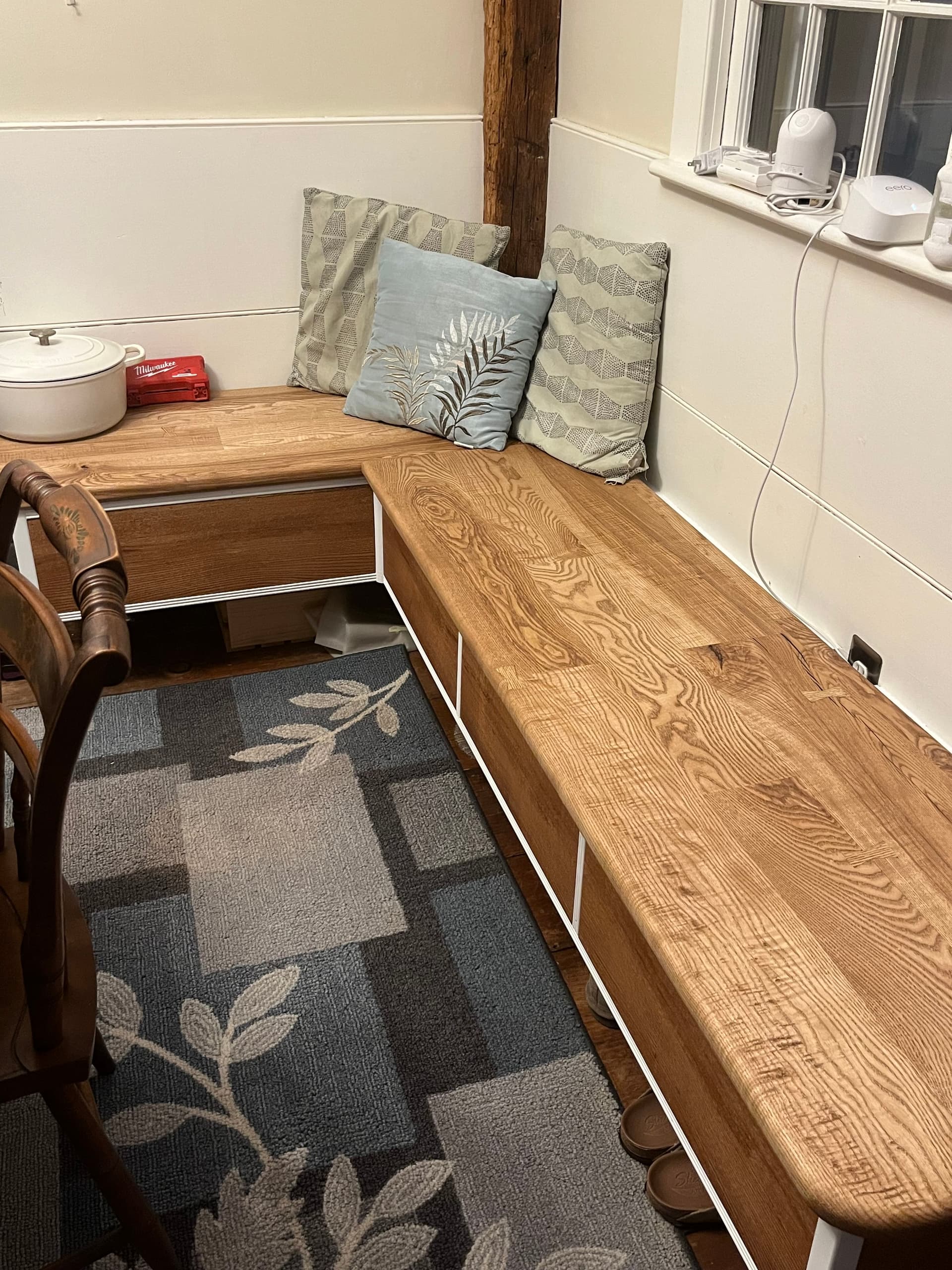 Side view of a live edge dining table showing the natural edge and slab thickness